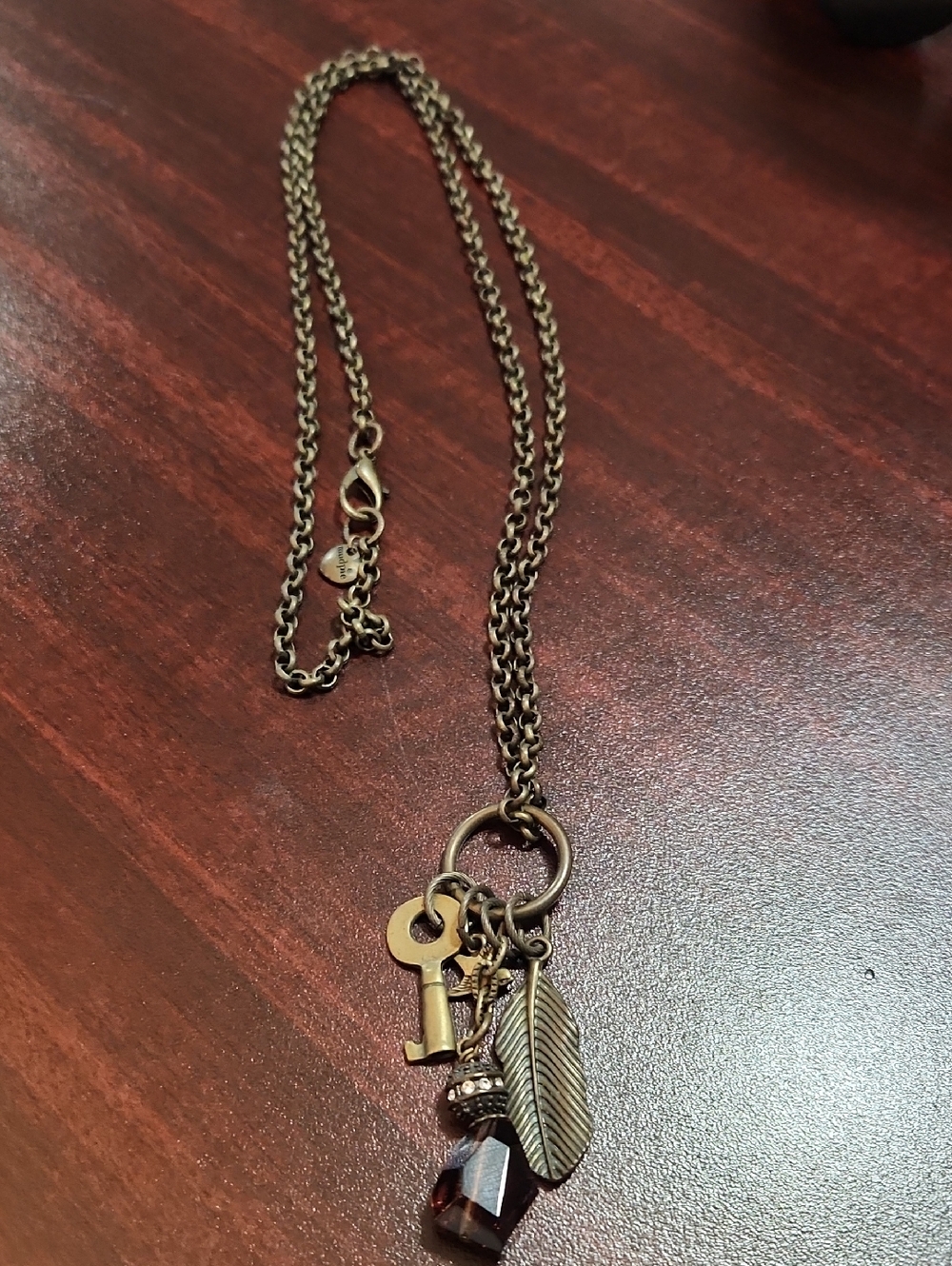 Mud Pie Gold Key, Feather & Garnet Charm Necklace
